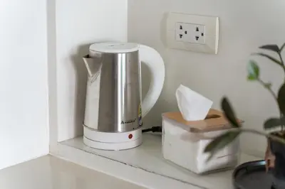 a blender sitting on a counter next to a box at Luxury Prime Thong Lor - Fast WiFi, Gym&Pool in Bangkok
