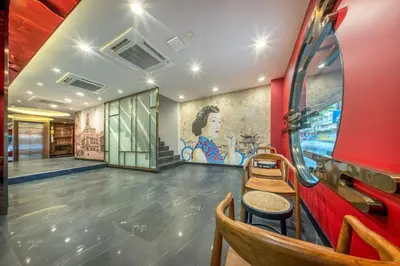 a room with a painting on the wall at U TOR Yaowarat - Bangkok Chinatown in Bangkok