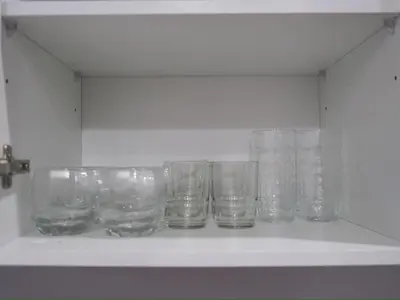 a row of empty glasses sitting on a shelf at Entire Home 2BR 2BA Chinatown near Yaowarat - Songwat in Bangkok