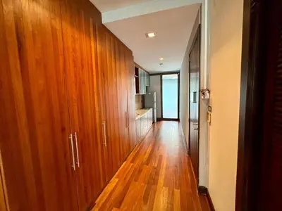 a hallway with wooden cabinets and a hard wood floor at XX Wish Inn Silom BKK - วิช อินน์ สีลม in Bang Rak