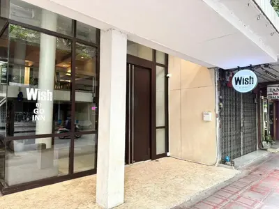 a entrance to a building with a msiss sign on it at XX Wish Inn Silom BKK - วิช อินน์ สีลม in Bang Rak