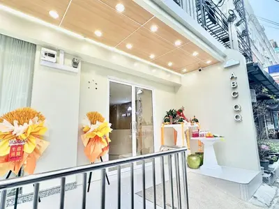 a balcony of a house with two large wreaths at ABCQQ Hotel Bangkok in Bangkok