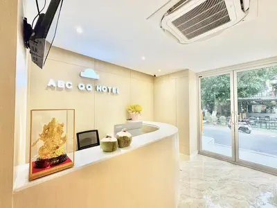 a lobby with a reception counter in a building at ABCQQ Hotel Bangkok in Bangkok