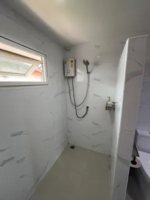 a bathroom with a shower and a window at Baan Saen Saran guest house in Bangkok