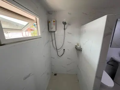 a bathroom with a shower and a sink at Baan Saen Saran guest house in Bangkok