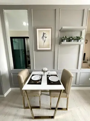 a dining room with a white table and chairs at The Elite Club - ThongLor Bangkok in Bangkok