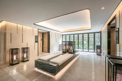 a bedroom with a large bed in a room with windows at Luxury Japanese Onsen Reserve - Bangkok in Bangkok