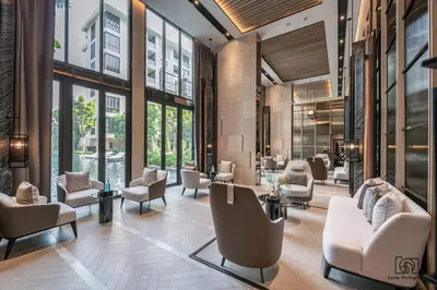 a waiting room with chairs and tables and windows at Luxury Japanese Onsen Reserve - Bangkok in Bangkok