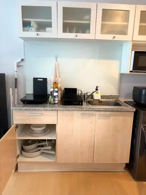 a kitchen with a sink and a counter at The Silent Sanctum in Bangkok