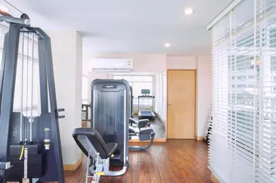 a gym with exercise equipment in a room at ICON NARINDRA SUITES HOTEL Sukhumvit Bangkok Thailand 50sqm to 90sqm Rooms & FREE Minibar in Bangkok