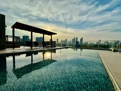 a swimming pool on the roof of a building at Elegant & Low Rise 2 Bedrooms in Bangkok