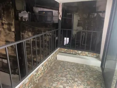 a balcony with a metal railing and a tile floor at Am Am Place D Near Rajamangala in Sathani Khlong Tan