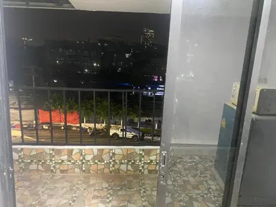 a view of a city skyline from a window at Am Am Place D Near Rajamangala in Sathani Khlong Tan
