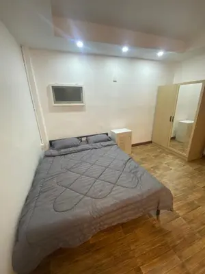 a bedroom with a large bed in a room at Am Am Place 2 Near Rajamangkala Stadium in Sathani Khlong Tan