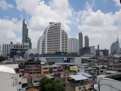 a view of a city with a large building at The Studio at Sathorn Terrace in Bangkok