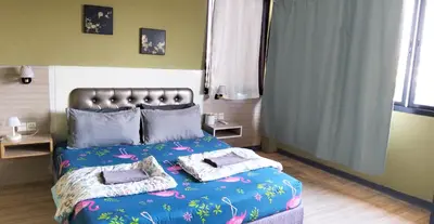 a bedroom with a bed with two pillows on it at SU SU khaosan hostels in Bangkok