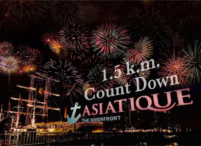 a sign with fireworks in the sky over a city at Belivin'98 Sense of Pier Sathorn Residence in Bangkok