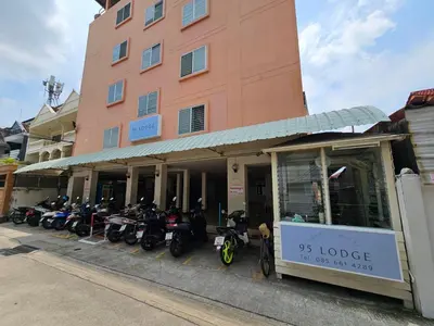 a row of motorcycles parked in front of a building at 95 Lodge in Bangkok