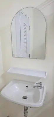 a white sink with a mirror above it at Homey Place easy access in Ban Song Hong