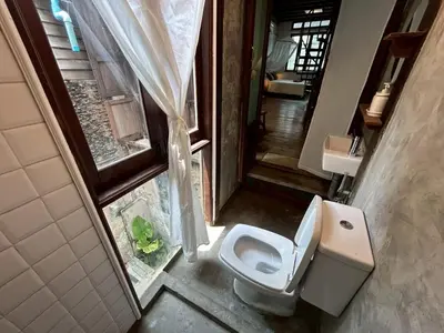 an overhead view of a bathroom with a toilet at Yellow House in Bangkok