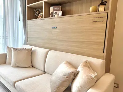 a white couch with pillows in a living room at Circle31 #2BR Bangkok in Bangkok