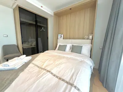 a bedroom with a large bed with a chain around it at Circle31 #2BR Bangkok in Bangkok