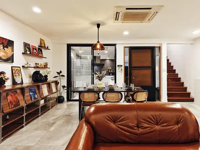 a living room with a leather couch and a table at 4BR Modern Art Villa with Free Wi-Fi Netflix Vinyl in Bangkok
