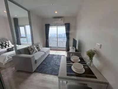 a living room with a couch and a table at High Floor Luxury Studio with Great Views in Bangkok