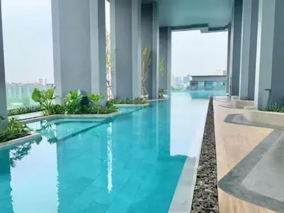 a swimming pool with blue water in a building at High Floor Luxury Studio with Great Views in Bangkok