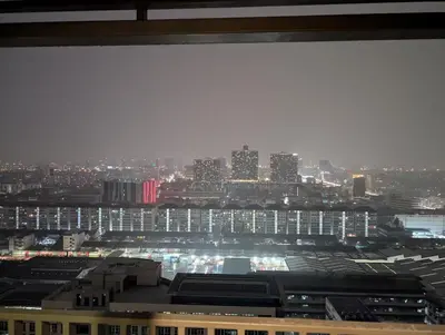 a view of a city at night from a building at High Floor Luxury Studio with Great Views in Bangkok