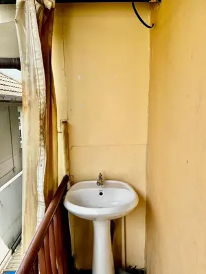 a bathroom with a white sink in a room at Chubbi 5 Room24 in Ban Bang Bamru