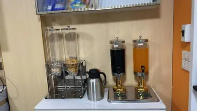 a counter with two blenders and a blender on it at Golden mango home Youth hostel \u91d1\u8292\u679c\u4e4b\u5bb6\u9752\u5e74\u65c5\u820d in Bangkok