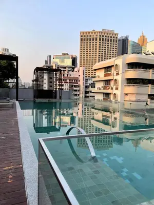 a pool of water in a city with buildings at 4Pax MRT BTS Asoke, Terminal21 in Bangkok