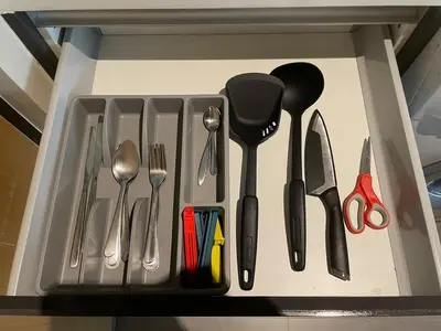 a drawer filled with utensils in a drawer at 4Pax MRT BTS Asoke, Terminal21 in Bangkok
