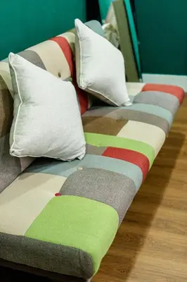 a row of beds with pillows on the floor at The Sleepyard Sathorn 11 in Bangkok