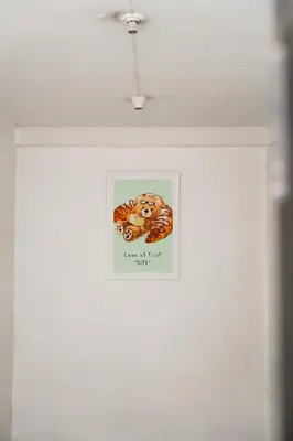 a picture of a tiger on a white wall at Lotus Bear House - 1BR Loft in Bangkok