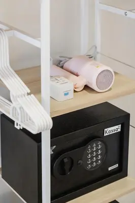 a microwave oven with a chair on a shelf at Lotus Bear House - 1BR Loft in Bangkok