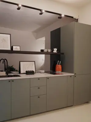 a kitchen with gray cabinets and a large refrigerator at Charming 3BR Design Loft in the Heart of Ari in Sathani Bang Su