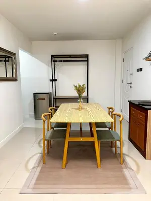 a dining room with a yellow table and chairs at Serene Escape 2 mins from SRT Wat Samien Nari in Bangkok