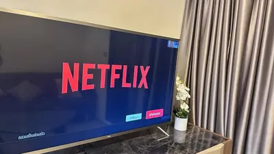 a television screen with the netflix sign on it at Beautiful condo, BTS Thonglor, 5mins by walking in Bangkok