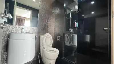 a bathroom with a toilet and a sink and a shower at Perfect condo, BTS Thong lo 5mins by walking in Bangkok