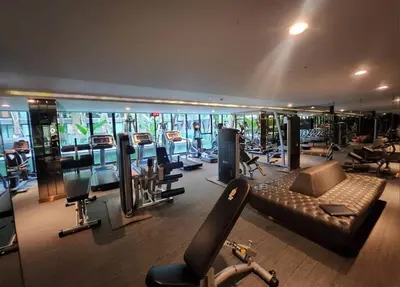 a gym with a lot of treadmills and machines at Lovely Condo-BTS Thong Lo 5mins in Bangkok