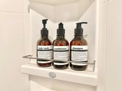 a refrigerator filled with four bottles of sauce at Cosy Studio near BTS in Bangkok