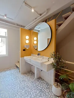 a bathroom with a sink and a mirror at Au Luna Bangkok Hostel in Bangkok