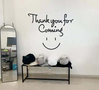 a sign that says thank you for continuing in front of a mirror at Tktattoo63 in Tha Akatsayan Don Muang