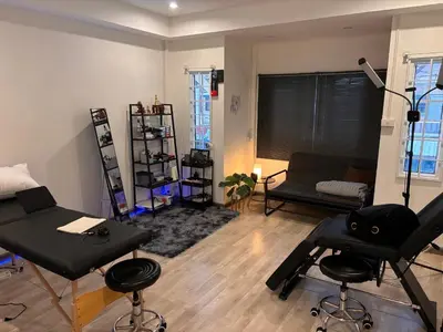 a living room with a hair salon with barber chairs at Tktattoo63 in Tha Akatsayan Don Muang