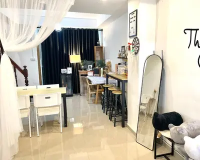 a room with chairs and tables and a mirror at Tktattoo63 in Tha Akatsayan Don Muang