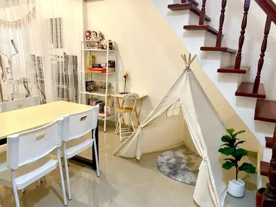 a play tent in a room with a table and chairs at Tktattoo63 in Tha Akatsayan Don Muang