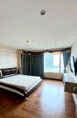 a bedroom with a bed and a large window at Room near Iconsiam 2km in Bangkok