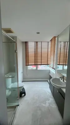 a large bathroom with two sinks and a toilet at Room near Iconsiam 2km in Bangkok